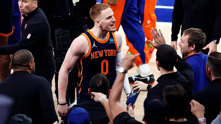 New York Knicks guard Donte DiVincenzo celebrates a win over the Philadelphia 76ers on April 22, 2024. - null