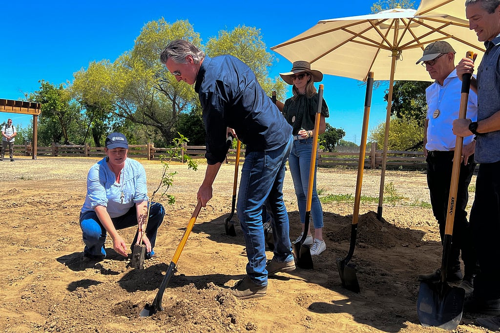 AP : California Gov. Gavin Newsom breaks ground at a new state park in a decade on Monday April 22, 2024 at the Dos Rios property, in Modesto, Calif. 