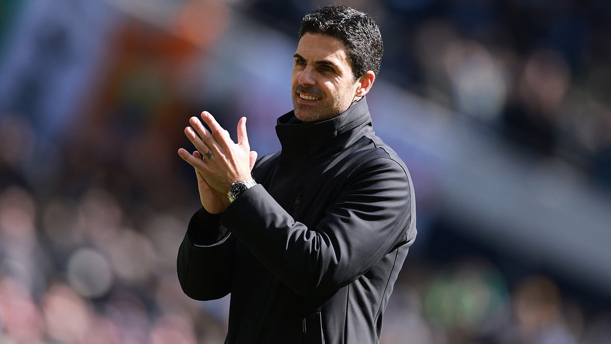 Mikel Arteta applauds the travelling Arsenal support following the Gunners' derby victory