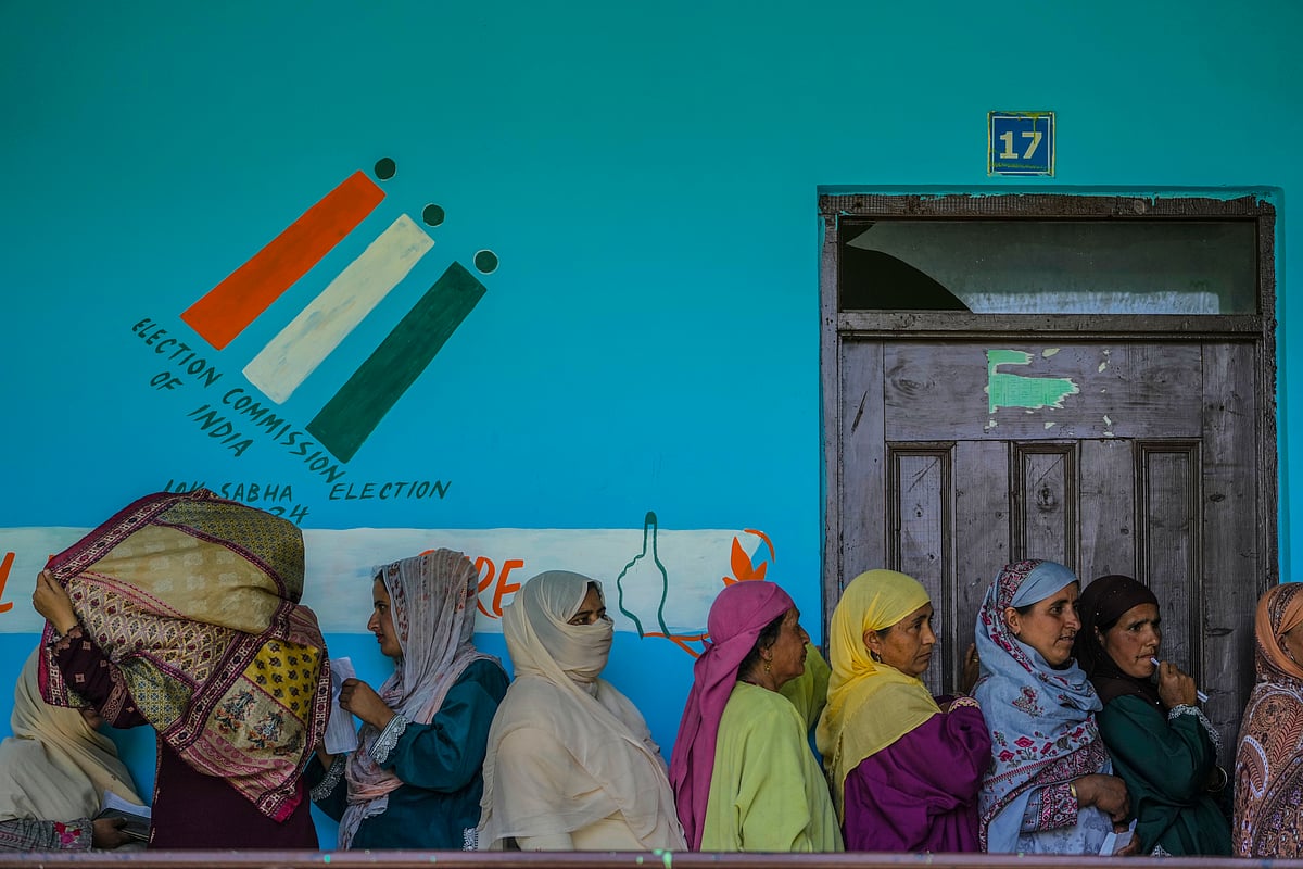 People stand in queue to cast their votes outside a polling booth during the fifth round of multi-phase national elections Sumbal north of Srinagar, Indian controlled Kashmir, Monday, May 20, 2024 - AP
