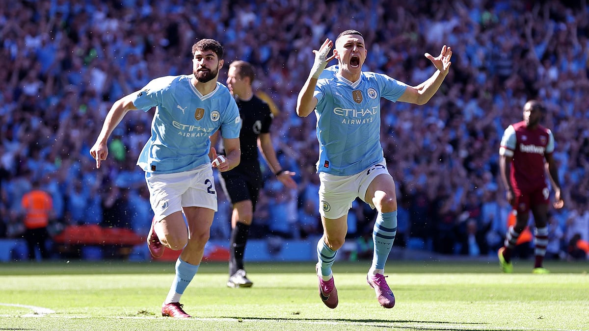 Phil Foden celebrates his stunning opener against West Ham. - null