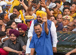 | Photo: PTI : Delhi CM Arvind Kejriwal and Punjab CM Bhagwant Mann hold roadshow in Delhi's Mehrauli