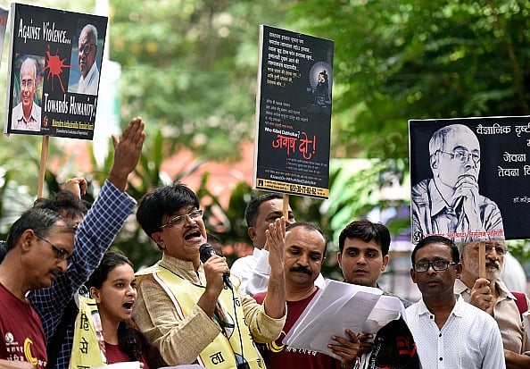 Getty Images : Activists from different organisation shout slogan during protest rally #WhoKilledDhabolkar in Mumbai.