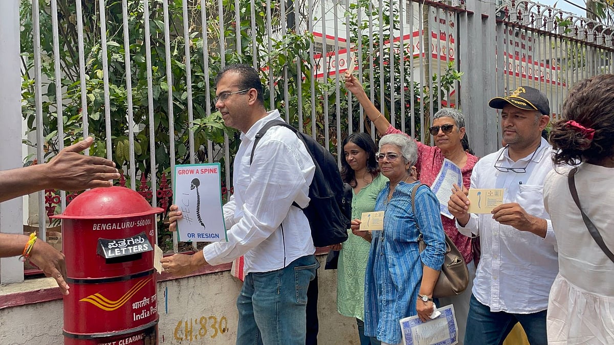 Civil society members send postcard to the ECI as part of 'Grow A Spine Or Resign' campaign in Bengaluru.