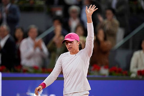 Iga Swiatek celebrates after winning final