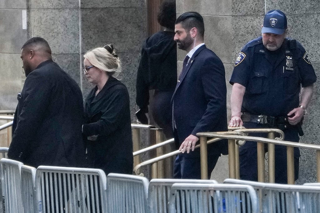 Stormy Daniels, second from left, exits the courthouse in New York - Seth Wenig / AP