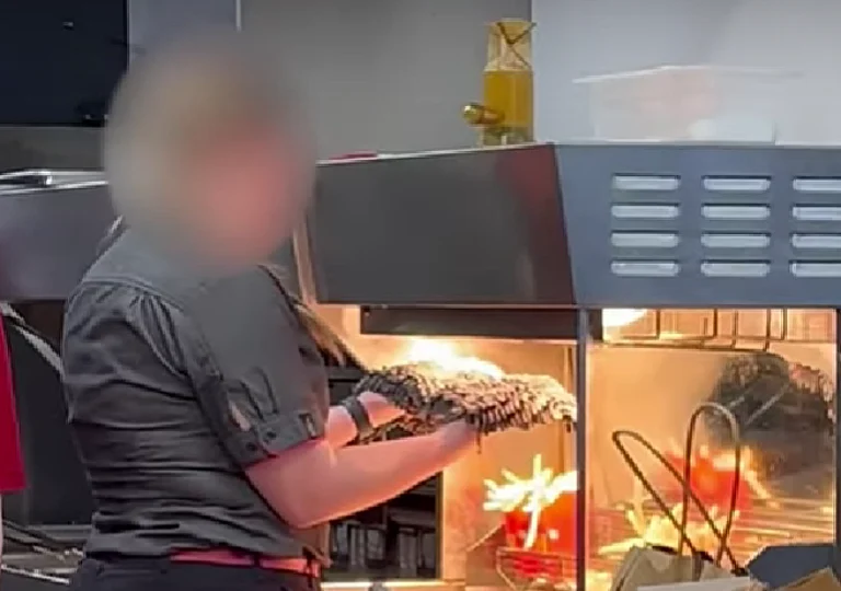 McDonald’s employee was caught drying a mop under heat lamps near fries.  - null