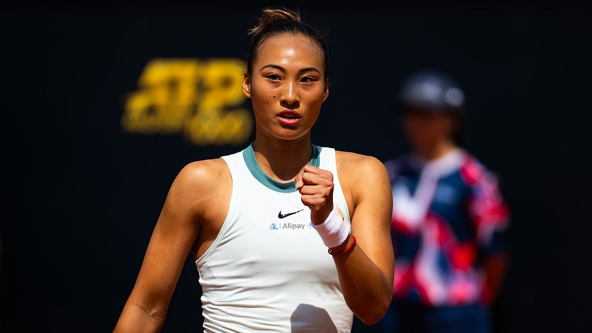 Zheng Qinwen celebrates her victory over Naomi Osaka.