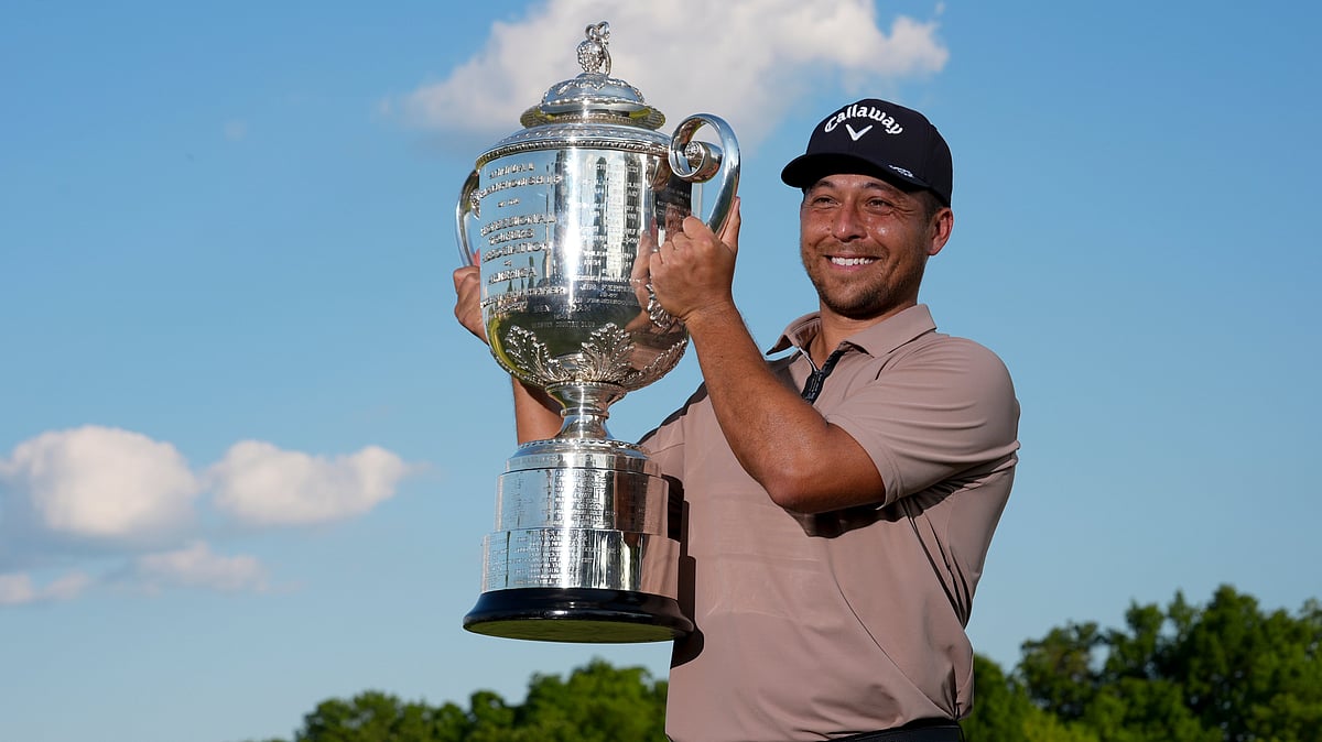 AP : Xander Schauffele holds the Wanamaker trophy after winning the PGA Championship golf tournament at the Valhalla Golf Club.