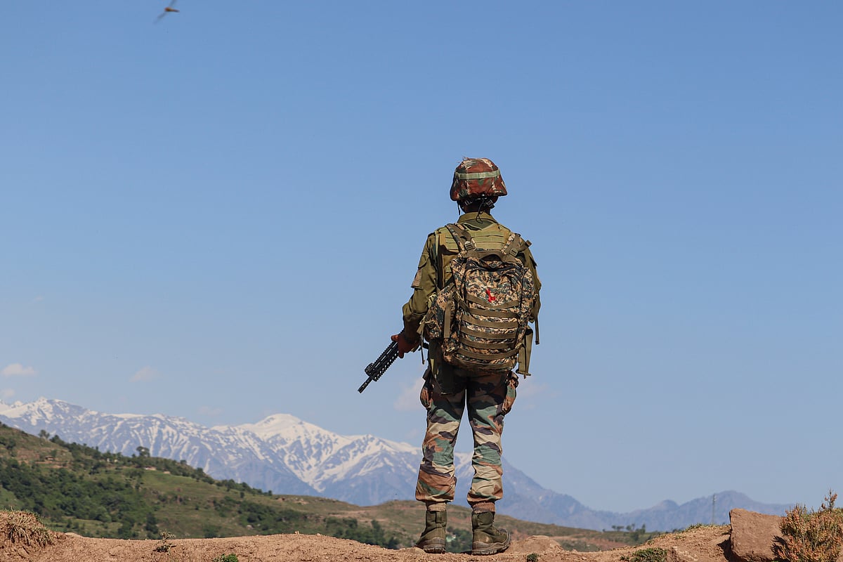An Indian Army soldier stands guard near the Line of Control (LoC), in Poonch district of Jammu & Kashmir - PTI
