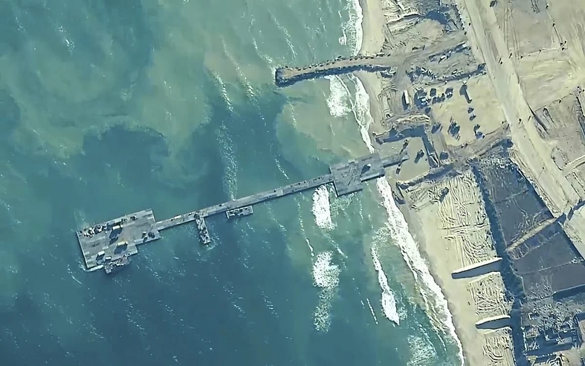 AP : Trucks carrying aid for the Gaza Strip rolled across a newly built US floating pier