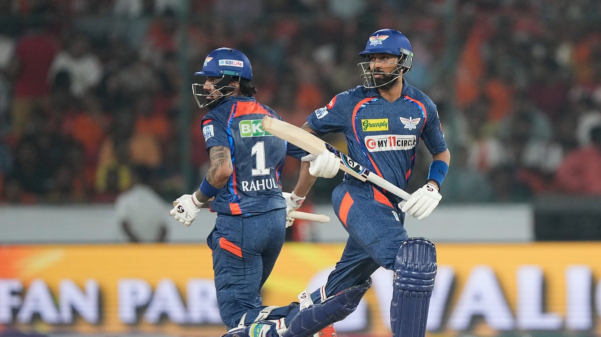 AP Photo/Mahesh Kumar A. : Lucknow Super Giants' Krunal Pandya, right, and captain KL Rahul run between the wickets during the Indian Premier League cricket match between Sunrisers Hyderabad and Lucknow Super Giants in Hyderabad.