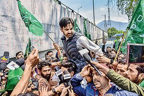 PDP’s Waheed-ur-Rehman Parra talks to the media at an election rally in Srinagar