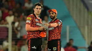 AP Photo/Ajit Solanki : Sunrisers Hyderabad's Bhuvneshwar Kumar, right, interacts with captain Pat Cummins during the Indian Premier League qualifier cricket match between Kolkata Knight Riders and Sunrisers Hyderabad in Ahmedabad.