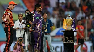 AP Photo/Ajit Solanki : Sunrisers Hyderabad's captain Pat Cummins, left, and Kolkata Knight Riders' captain Shreyas Iyer look at the winner's trophy before the toss ahead of the Indian Premier League qualifier cricket match between Kolkata Knight Riders and Sunrisers Hyderabad in Ahmedabad.