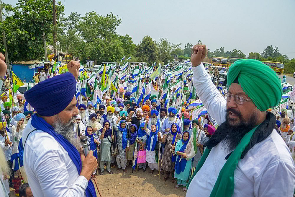 Photo: PTI : Farmers protest against PM Modi's rally