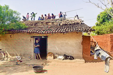 Villagers work on converting a mud house into a pakka one under the PM Awas Yojana with their own resources, after cutting out middlemen