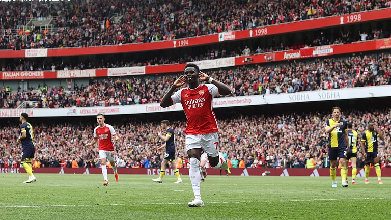 Arsenal's Bukayo Saka celebrates opening the scoring against Bournemouth at the Emirates Stadium in the English Premier League on Saturday (May 4, 2024). - null