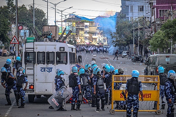  (Photo via Getty Images) : Security personnel fire tear gas as students protest against the killing of two missing students and to demand peace in India's northeastern state of Manipur amid ongoing ethnic violence, in Imphal on September 27, 2023. 


