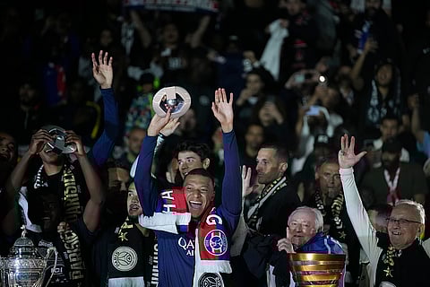 Kylian Mbappe celebrates with teammates