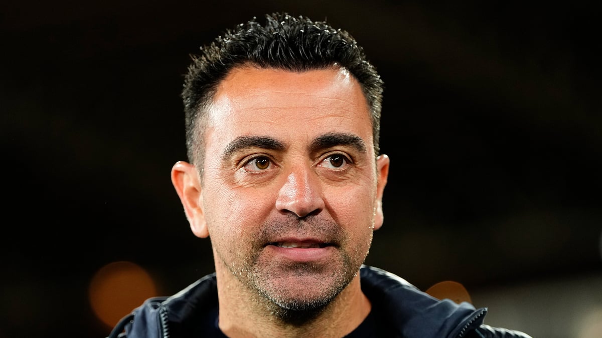 Barcelona's head coach Xavi Hernandez walks to his seat before a Spanish La Liga soccer match between Almeria and Barcelona at the Power Horse stadium in Almeria. - AP Photo/Jose Breton