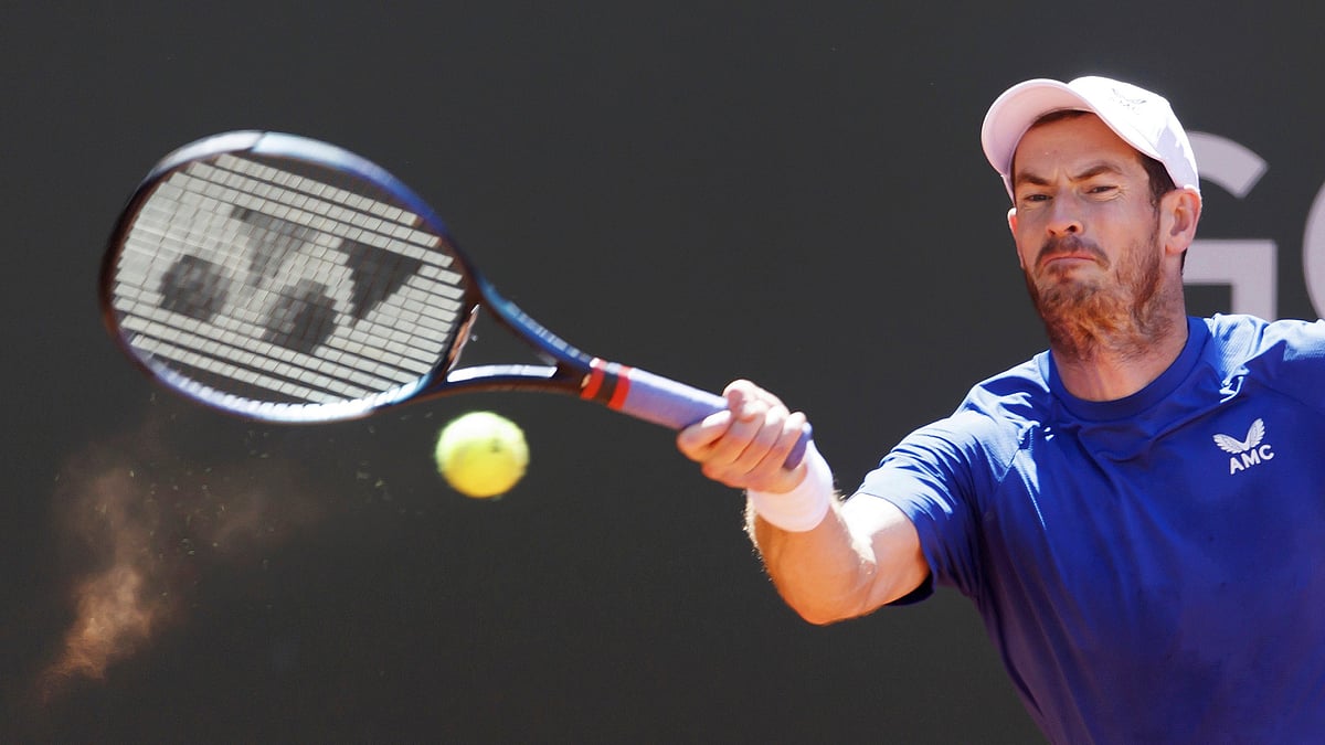 AP : Andy Murray, of Great Britain, returns the ball to Yannick Hanfmann, of Germany, during the men's singles first round of the ATP 250 Geneva Open tournament in Geneva, Switzerland, Tuesday, May 21, 2024.