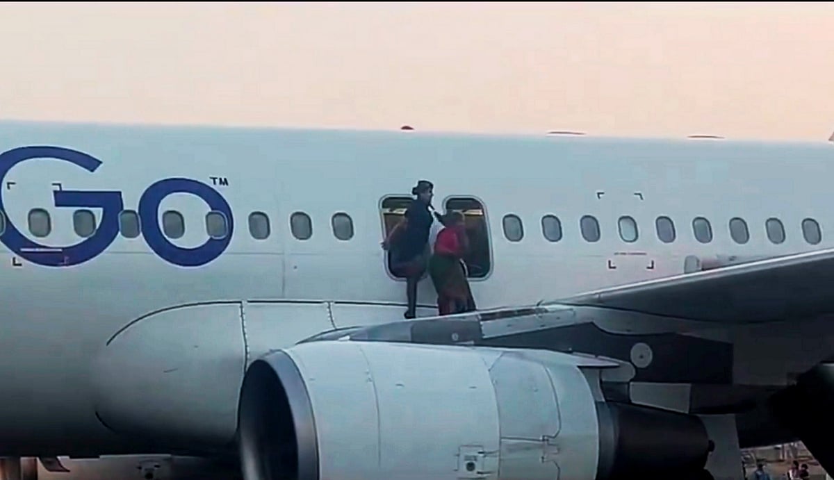 A passenger being evacuated after the Varanasi-bound IndiGo flight received bomb threat on Tuesday  |    - PTI