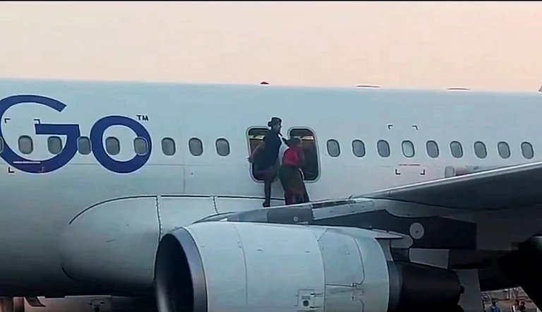 A passenger being evacuated after the Varanasi-bound IndiGo flight received bomb threat on Tuesday  |    - PTI