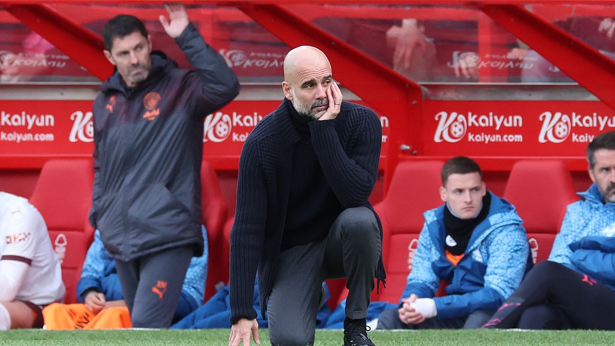 Pep Guardiola looks on during Manchester City's 2-0 win at Nottingham Forest last week. - null