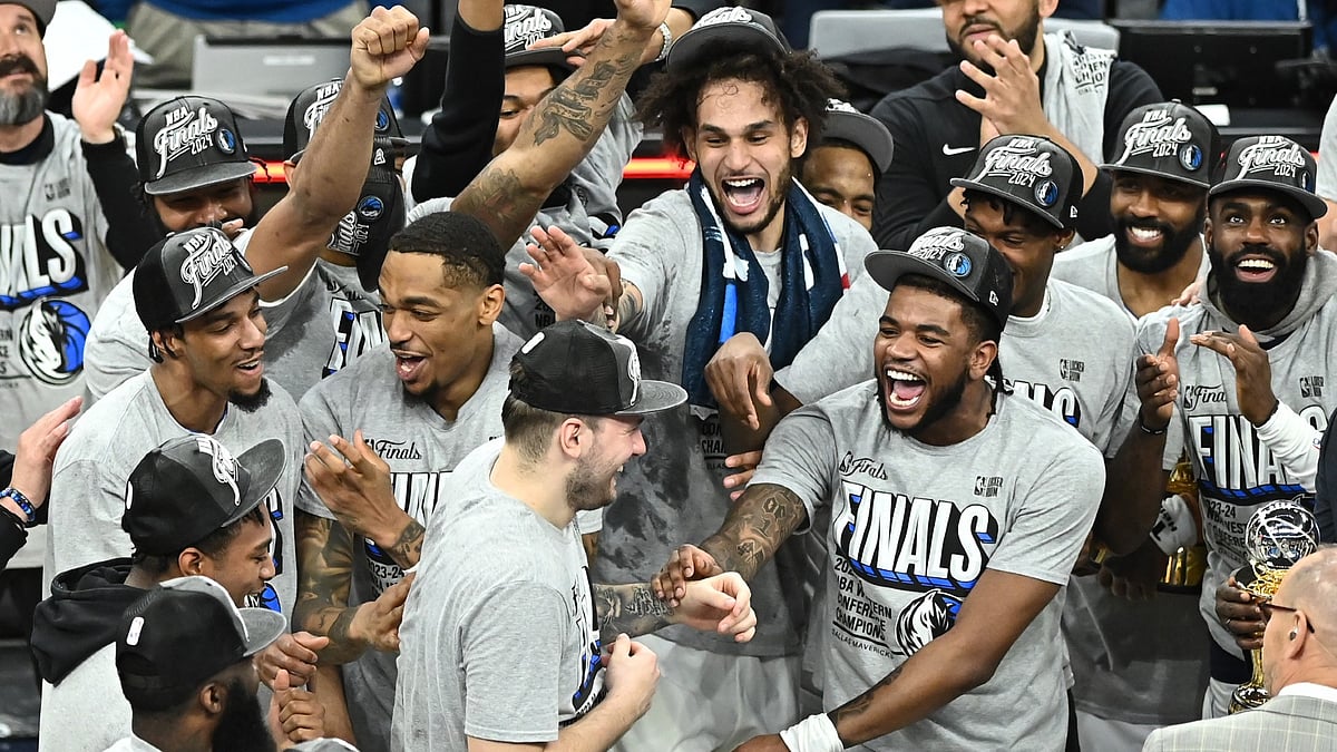 Luka Doncic #77 of the Dallas Mavericks celebrates with teammates after being named the MVP after Game Five of the Western Conference Finals against the Minnesota Timberwolves at Target Center on May 30, 2024 in Minneapolis, Minnesota. - null