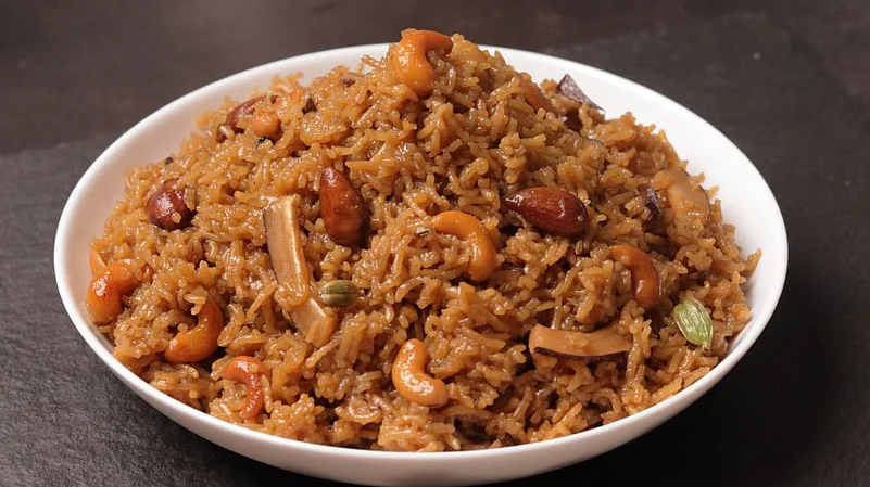 A bowl of Gur wale Chawal - rice with nuts and cashews, a delicious and nutritious meal option.