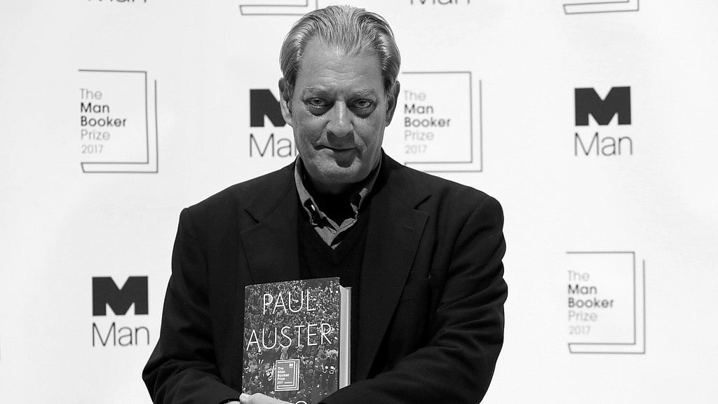 U.S. author Paul Auster poses with his book "4321" during a photocall with all six shortlisted authors of the 2017 Man Booker Prize for Fiction, in London, Oct. 16, 2017.  - AP