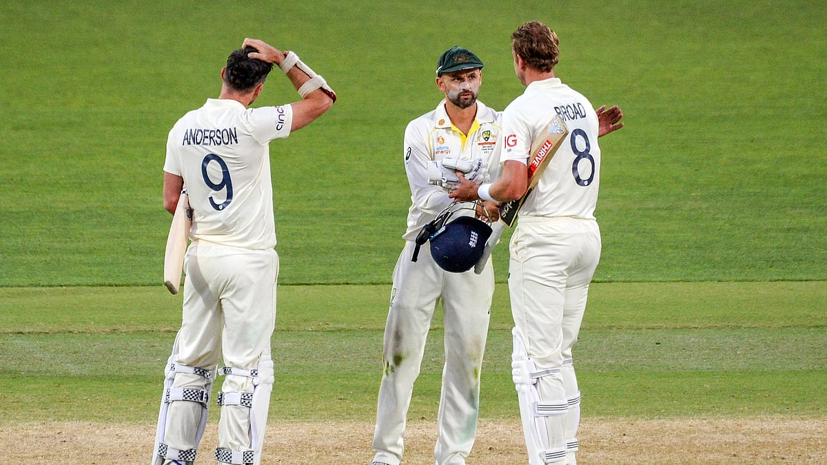Nathan Lyon (centre) cannot believe James Anderson (left) is retiring from Test cricket for England. - null