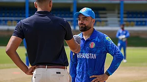 X/Afghanistan Cricket Board : Afghanistan captain Rashid Khan at the toss for their ICC T20 World Cup 2024 warm-up