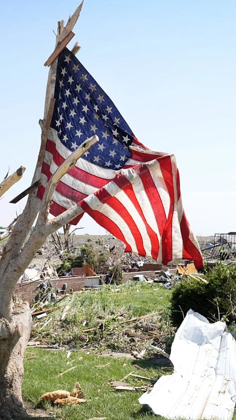 The US Flag Hangs With Destruction In Sight