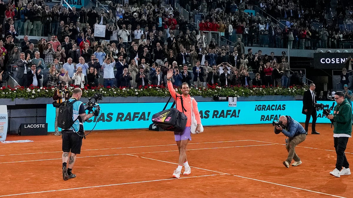 Rafael Nadal, center, waves to the crowd after losing his Madrid Open 2024 match against Jiri Lehecka in Madrid, Spain on April 30, 2024. - Manu Fernandez/AP