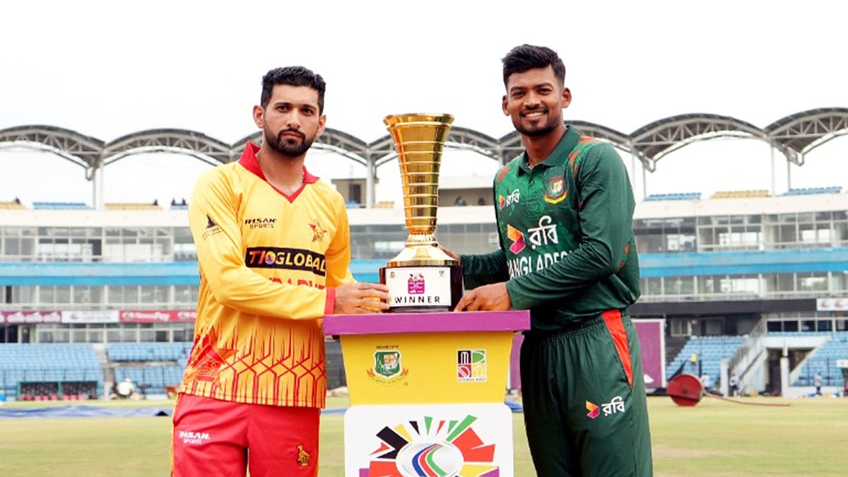 Photo: X/ @BCBtigers : Zimbabwe captain Sikandar Raza with Bangladesh's captain Najmul Hossain Shanto with the T20I trophy before the start of the series.