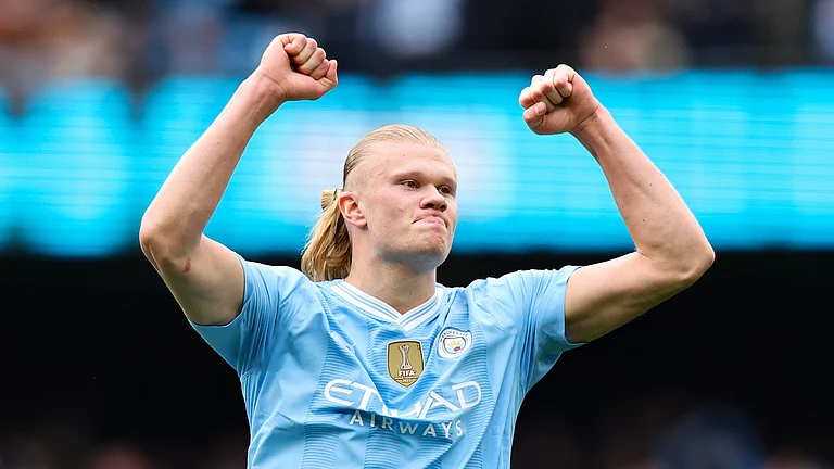 Erling Haaland stole the show with four goals as Manchester City kept hot on the tail of Arsenal in the English Premier League. - null