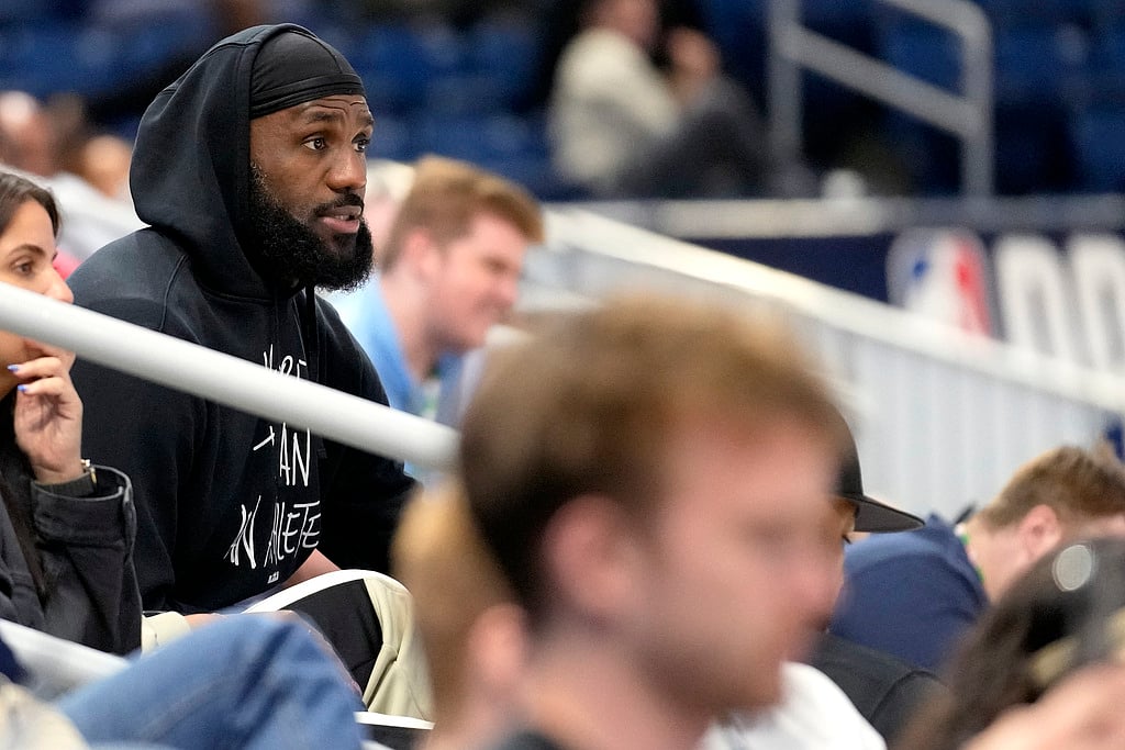  (AP Photo/Nam Y. Huh)
 : LeBron James watches his son Bronny James during the 2024 NBA Draft Combine 5-on-5 basketball game between Team St. Andrews and Team Love in Chicago, Wednesday, May 15, 2024.

