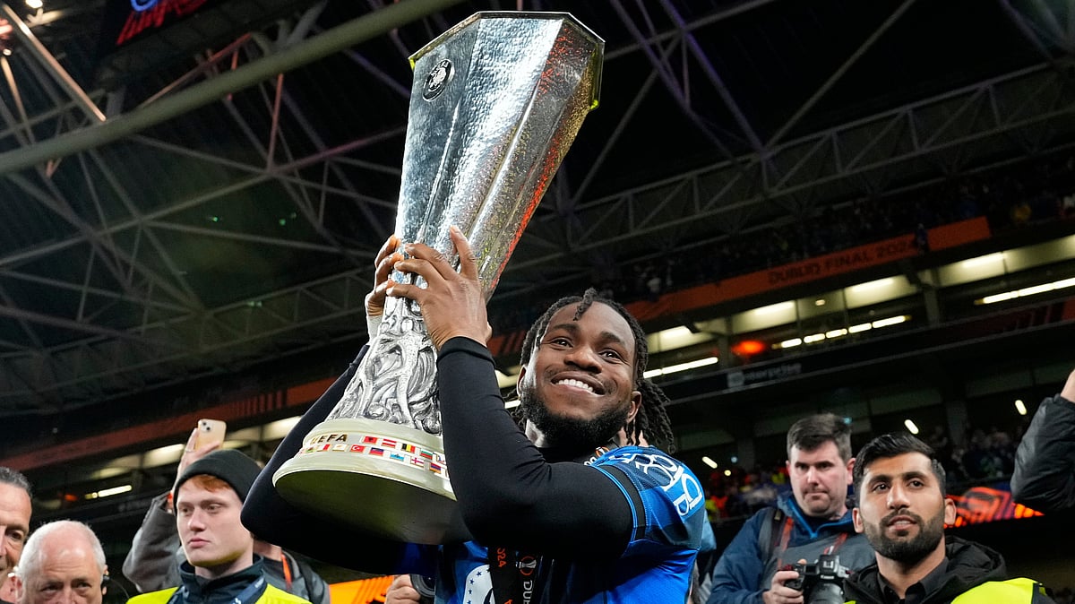 AP : Atalanta's Ademola Lookman holds the trophy after his team won the Europa League final soccer match between Atalanta and Bayer Leverkusen at the Aviva Stadium in Dublin, Ireland.