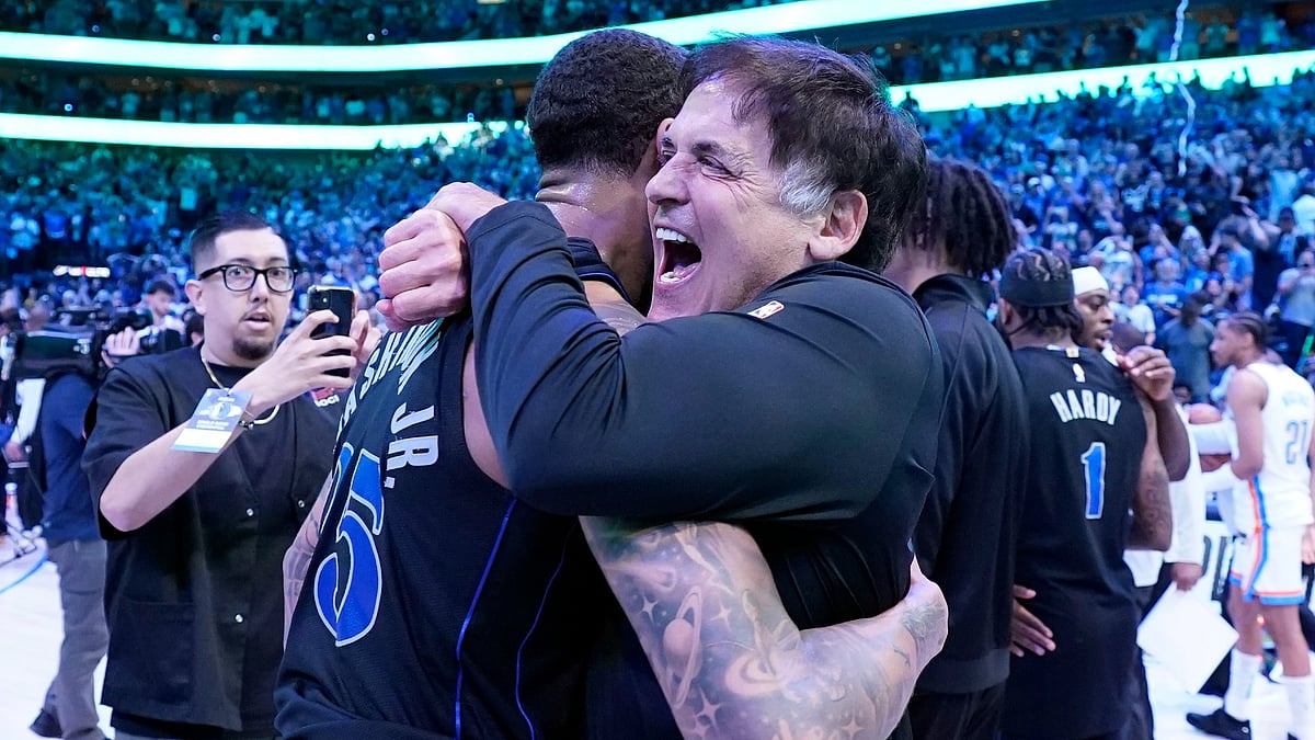 Dallas Mavericks owner Mark Cuban and P.J. Washington #25 celebrate after their win over the Oklahoma City Thunder. - null