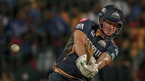 AP Photo : Gujarat Titans' David Miller plays a shot during the Indian Premier League cricket match between Royal Challengers Bengaluru and Gujarat Titans in Bengaluru.