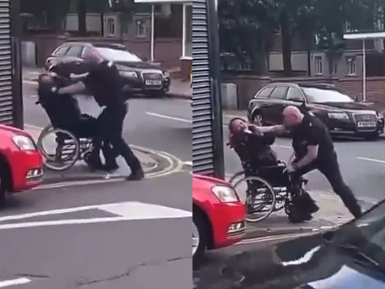 The policeman was seen hitting and punching the man on wheelchair. - X