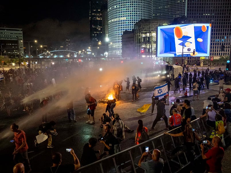 AP : Police use water cannon to disperse demonstrators during a protest against Israeli Prime Minister Benjamin Netanyahu's government, and calling for the release of hostages held in the Gaza Strip by the Hamas militant group, in Tel Aviv, Israel, Saturday |