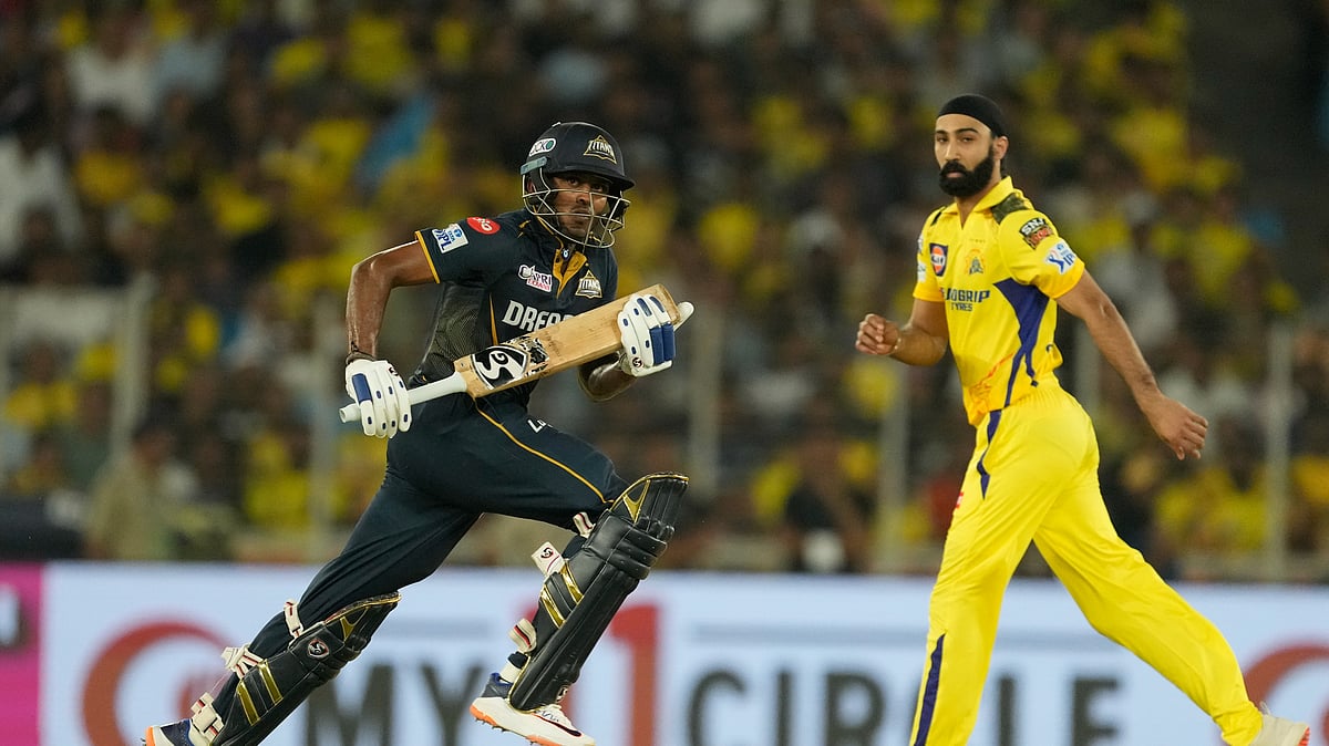 Gujarat Titans' Sai Sudharsan take run as Chennai Super Kings' Simarjeet Singh watches during the Indian Premier League cricket match between Gujarat Titans and Chennai Super Kings in Ahmedabad. - AP Photo/Ajit Solanki