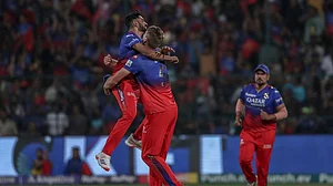 (AP Photo) : Royal Challengers Bengaluru's Mohammed Siraj, left and Cameron Green celebrates the dismissal of Gujarat Titans' Sai Sudharsan during the Indian Premier League cricket match between Royal Challengers Bengaluru and Gujarat Titans in Bengaluru, India, Saturday, May 4, 2024.