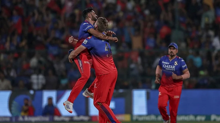 Royal Challengers Bengaluru's Mohammed Siraj, left and Cameron Green celebrates the dismissal of Gujarat Titans' Sai Sudharsan during the Indian Premier League cricket match between Royal Challengers Bengaluru and Gujarat Titans in Bengaluru, India, Saturday, May 4, 2024.
- (AP Photo)