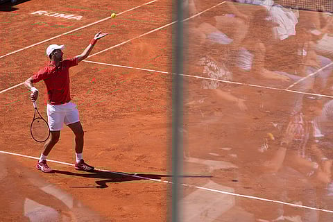 Djokovic serves the ball to Tabilo