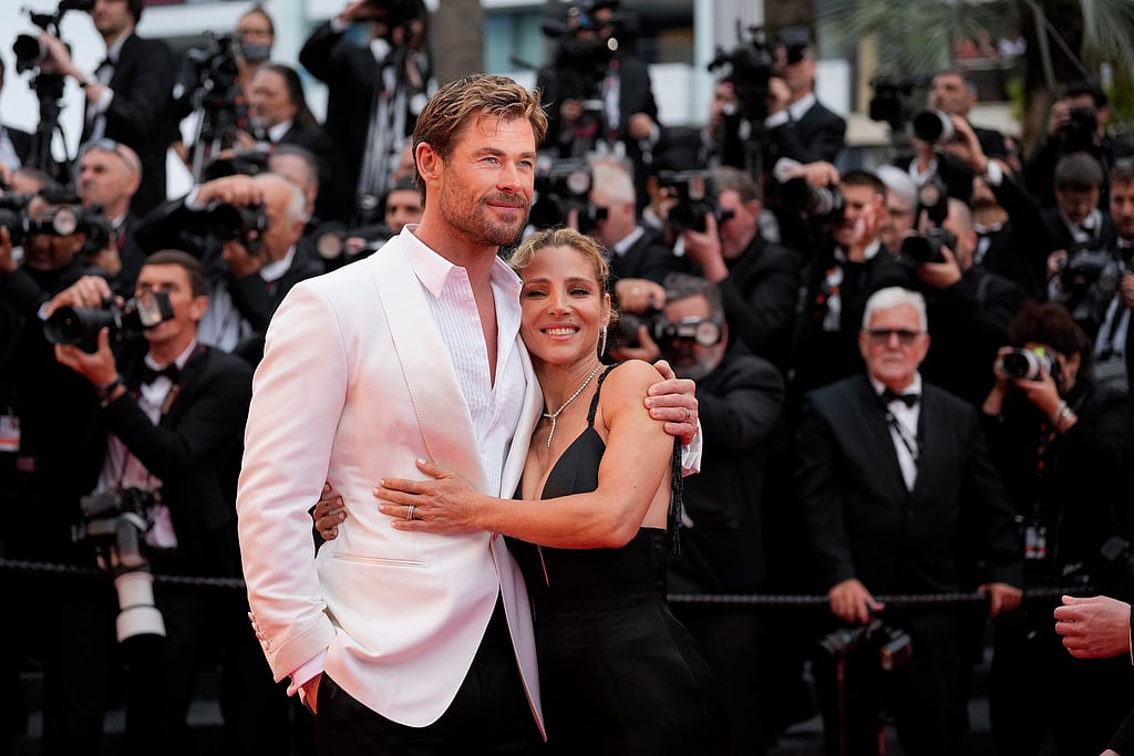 Andreea Alexandru/ AP : Chris Hemsworth, left, and Elsa Pataky pose for photographers upon arrival at the premiere of the film 'Furiosa: A Mad Max Saga' at the 77th international film festival, Cannes.