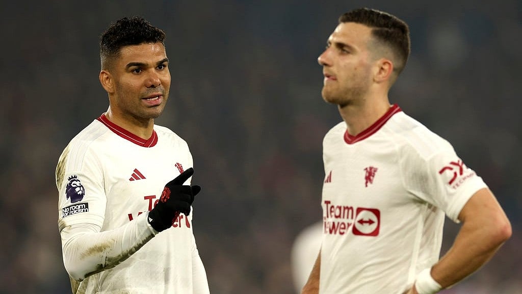 Manchester United's Casemiro, left, and Manchester United's Diogo Dalot react disappointed after the English Premier League soccer match between Crystal Palace and Manchester United. - AP